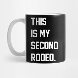 "This is my second rodeo." in plain white letters - cos you're not the noob, but barely Mug